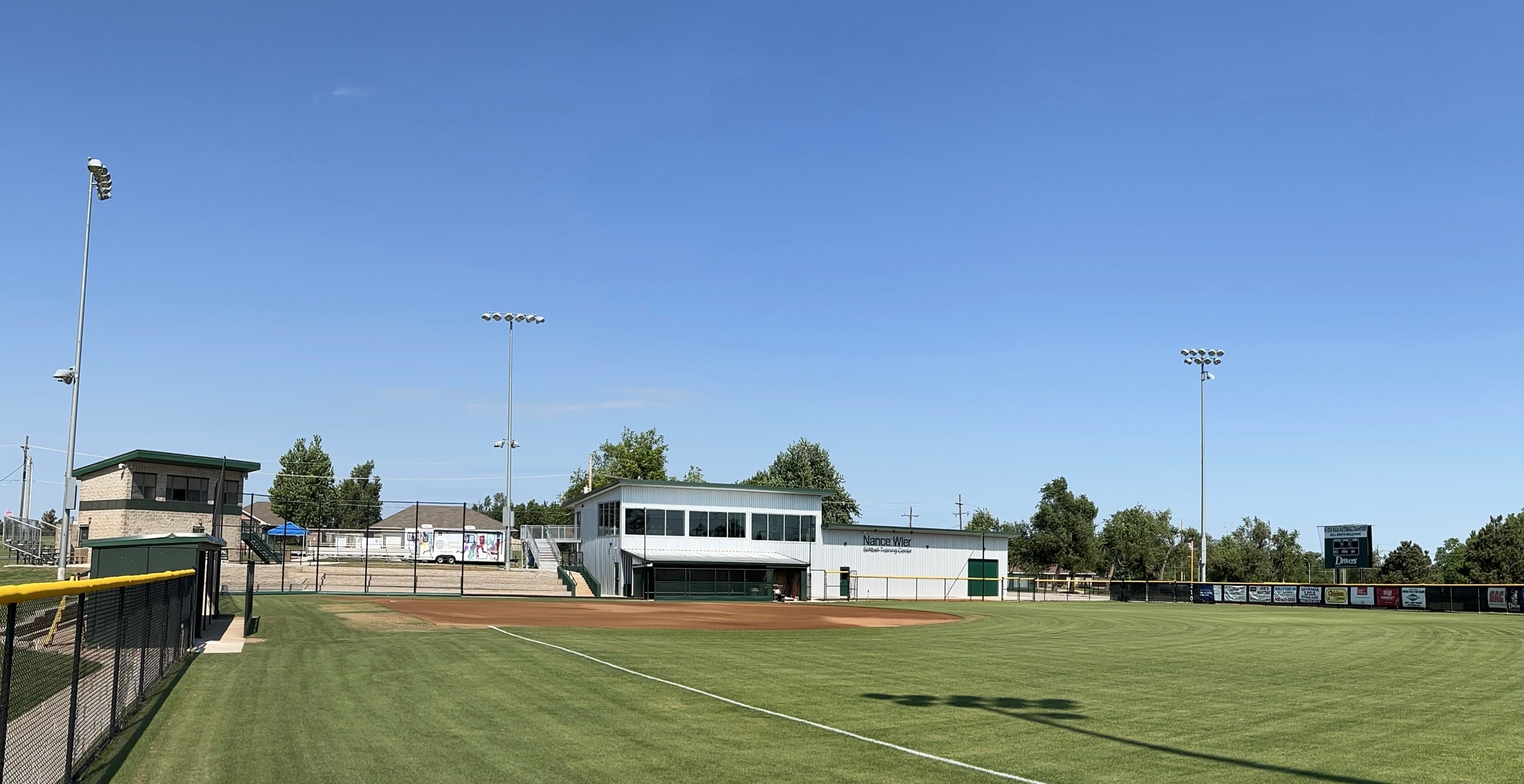 Outfield view of press box and training center.