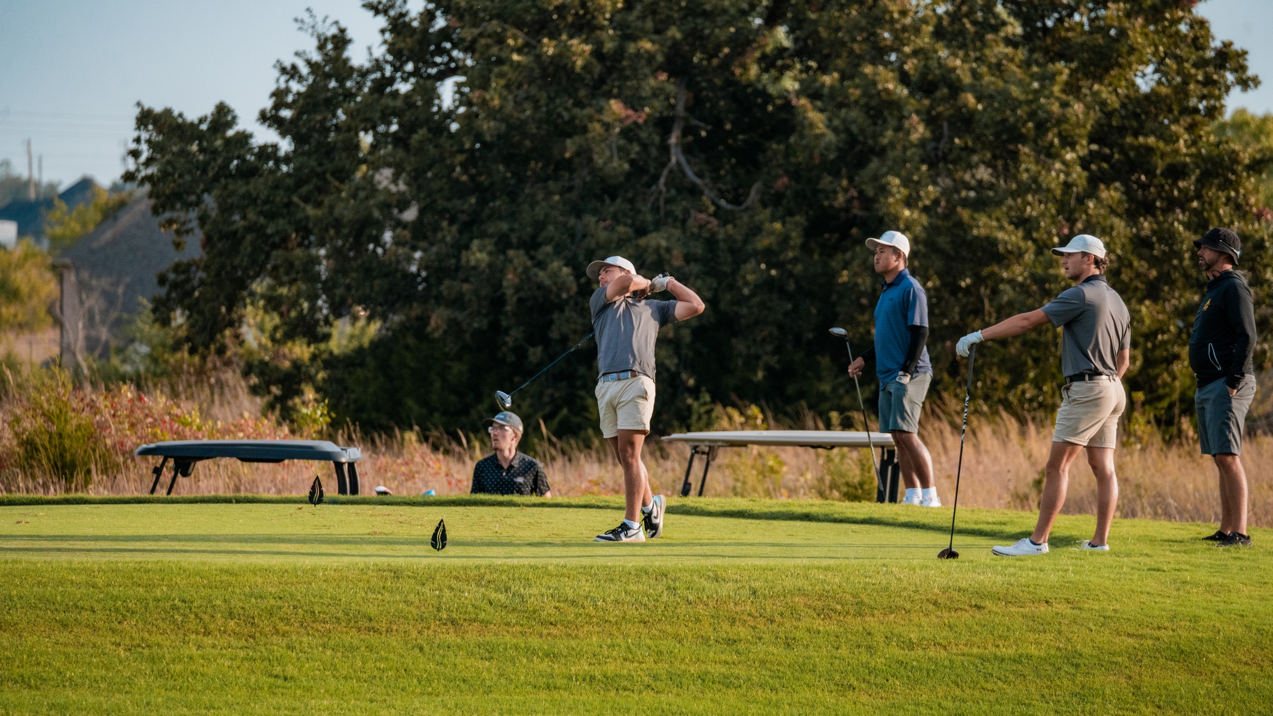 conner cryer hits a tee-shot.