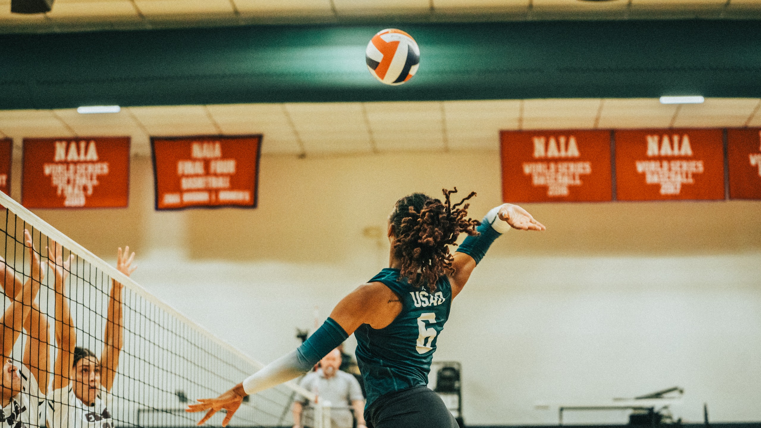 Jaliayh Cox  leaps in the air on a kill attempt.